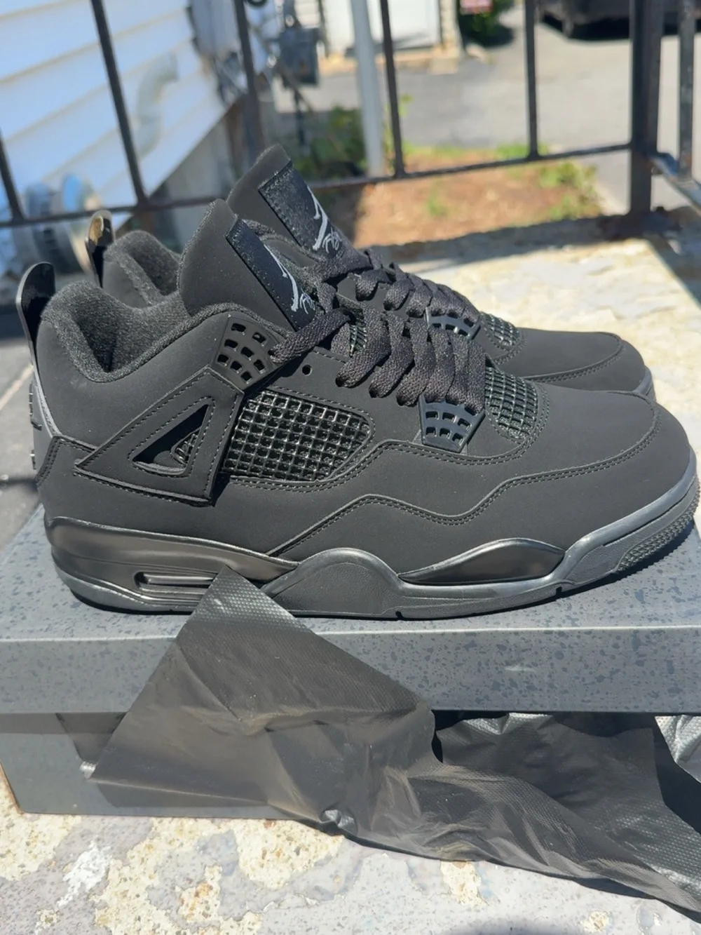 Jordan Men’s Black Retro 4 Sneakers